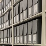 boxes of Sterling Brown correspondence on library shelving